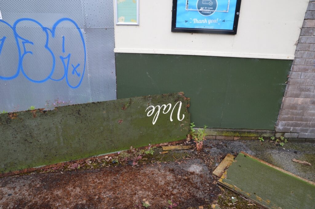 View of broken pub signage